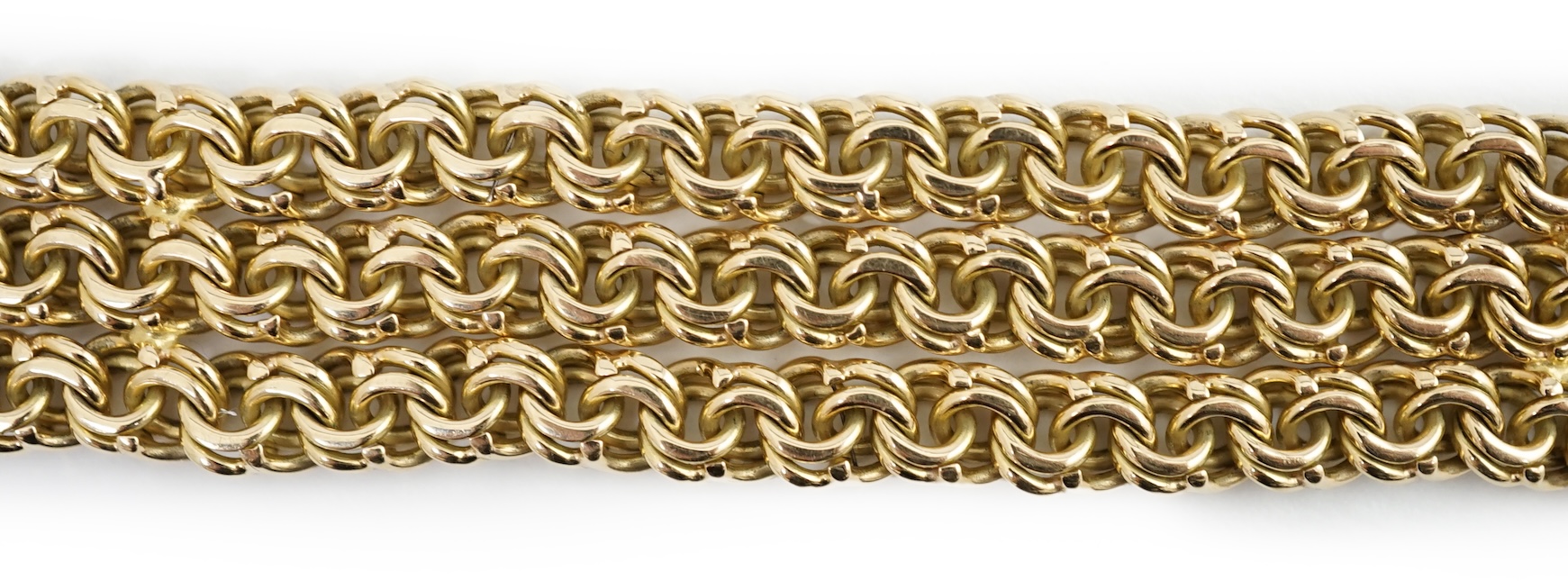 An 18k gold triple strand oval chain link bracelet